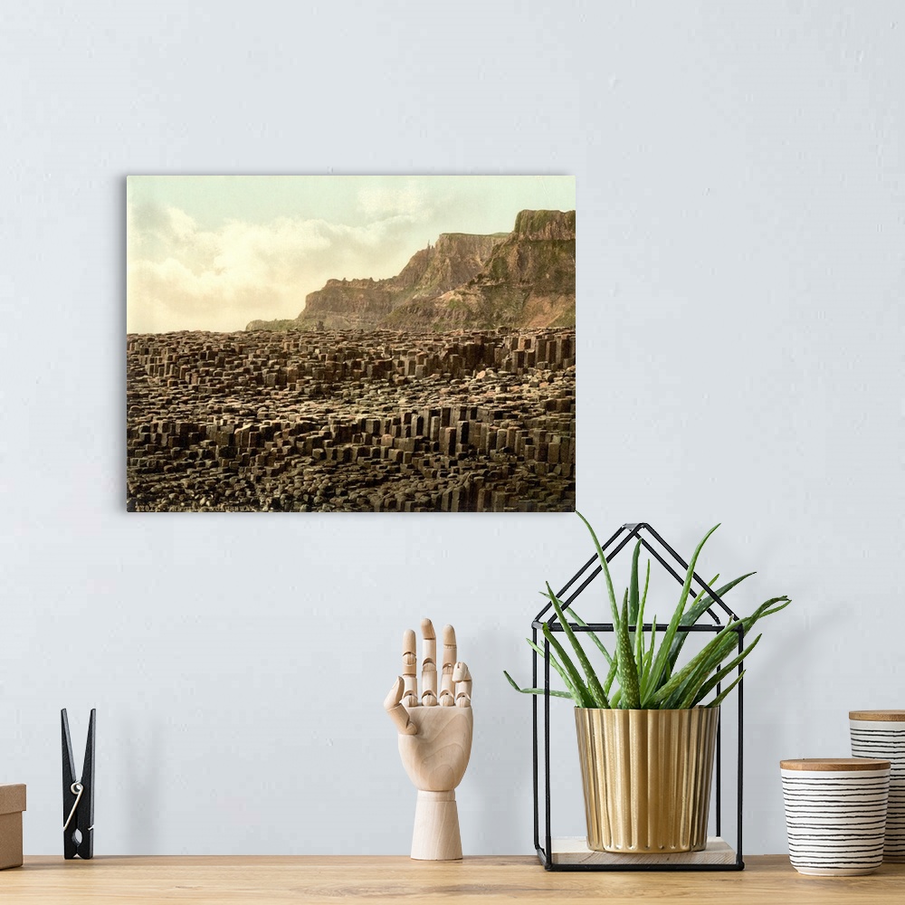 A bohemian room featuring Hand colored photograph of giant's causeway, country Antrim, Ireland.