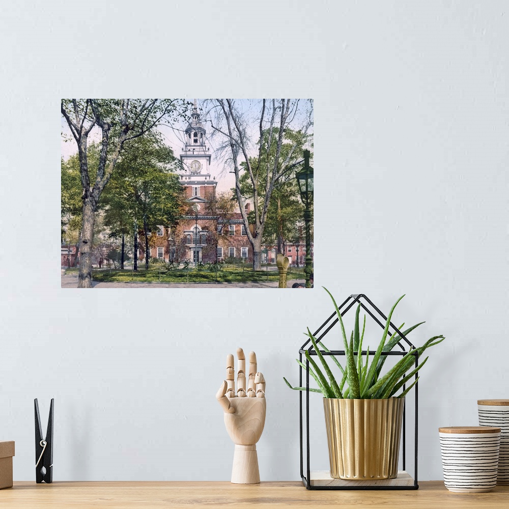 A bohemian room featuring Vintage, landscape photograph on a big canvas of Independence Hall seen through the trees in Phil...