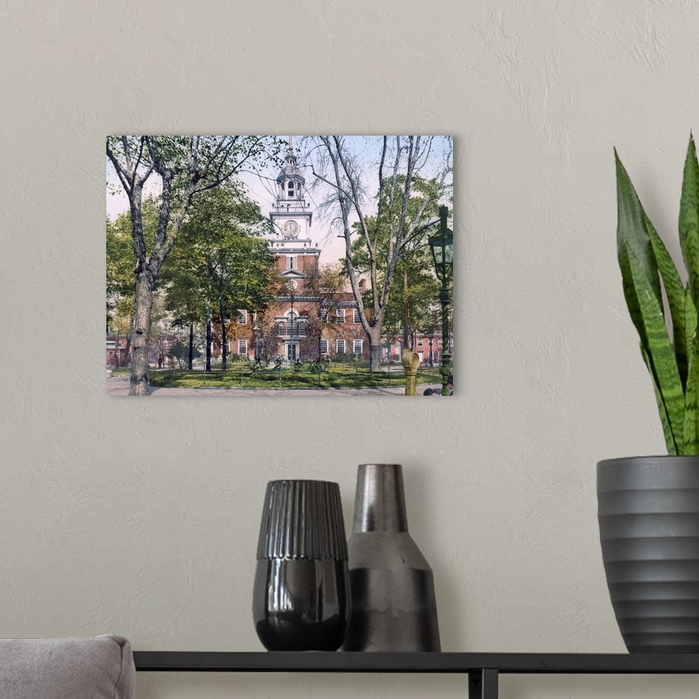 A modern room featuring Vintage, landscape photograph on a big canvas of Independence Hall seen through the trees in Phil...