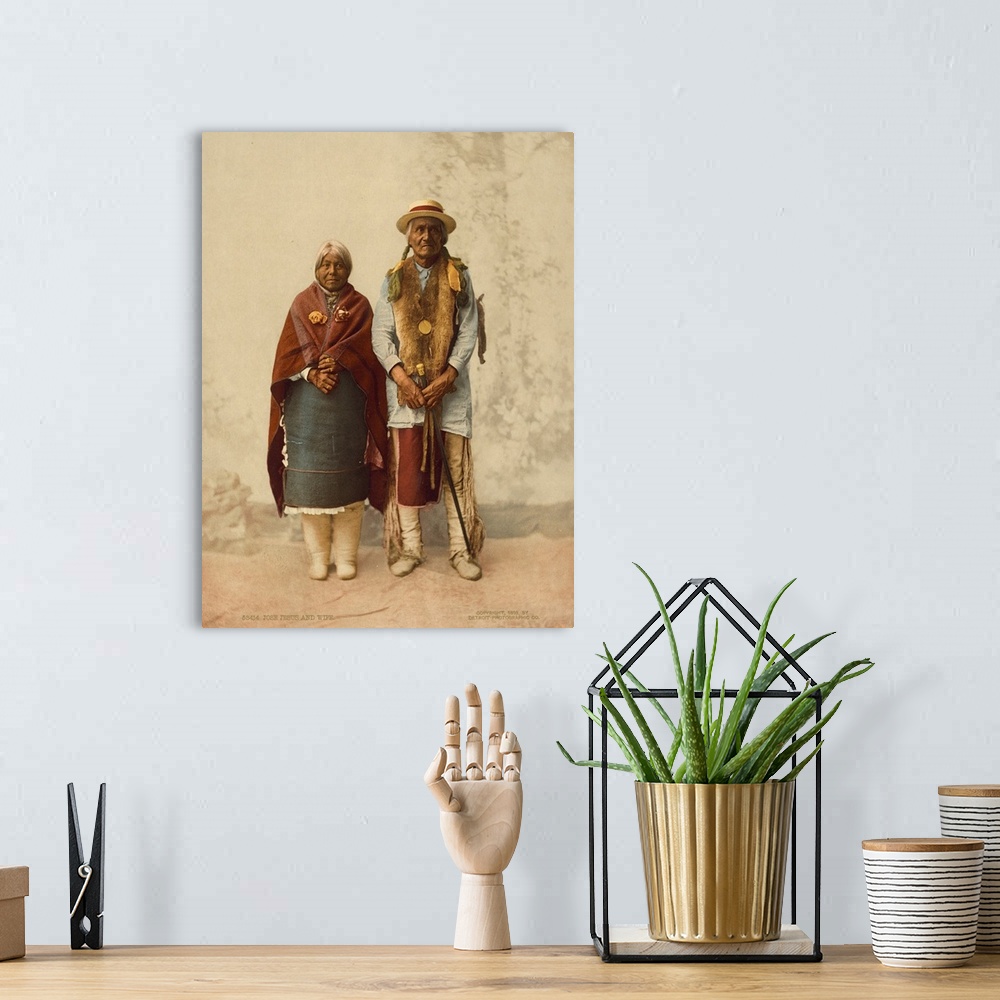 A bohemian room featuring Hand colored photograph of Jose, Jesus and wife.