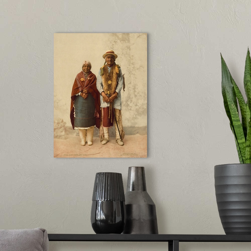 A modern room featuring Hand colored photograph of Jose, Jesus and wife.