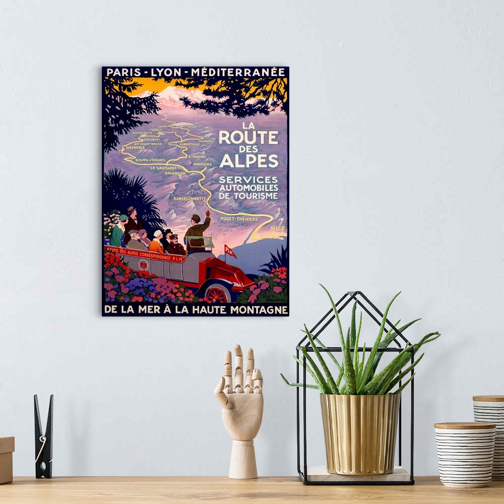 A bohemian room featuring This is a retro travel poster of a tour guide pointing out a map through the mountains of France ...