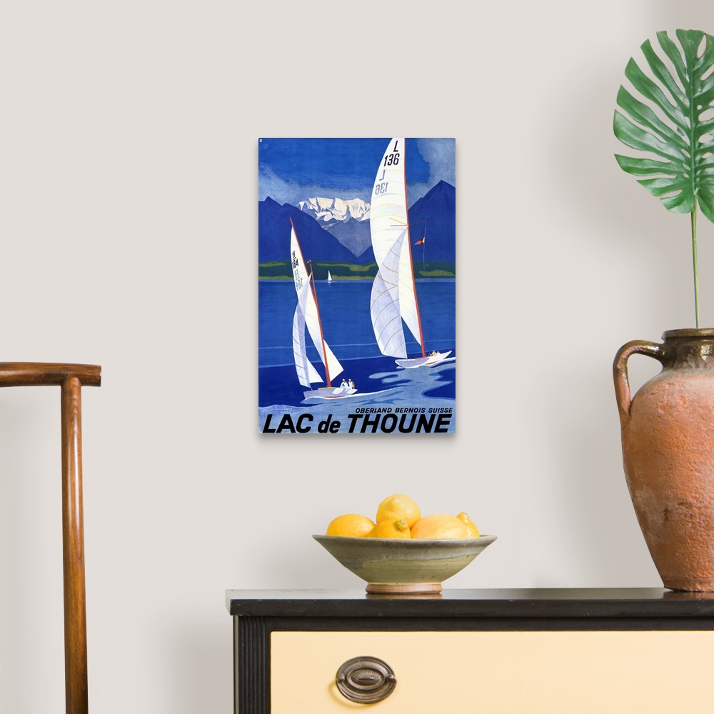 A traditional room featuring Old advertising poster artwork showing two sailboats racing in the water with golf course and sno...