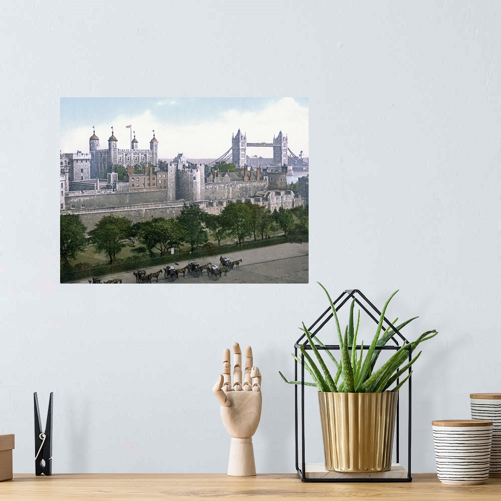 A bohemian room featuring A vintage urban landscape photograph of the Tower of London with horse drawn carts outside that h...
