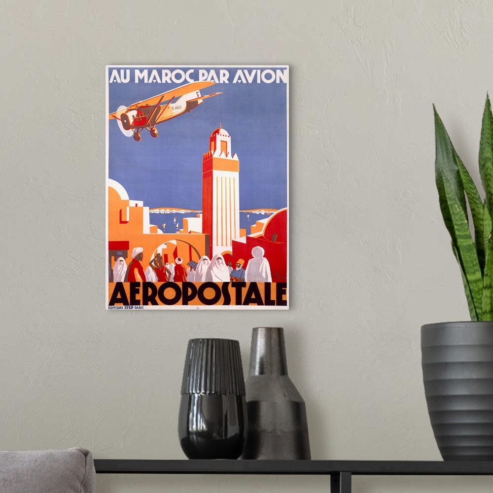 A modern room featuring Vintage travel poster highlighting the Moroccan Aeropostale airline with a single engine plane fl...