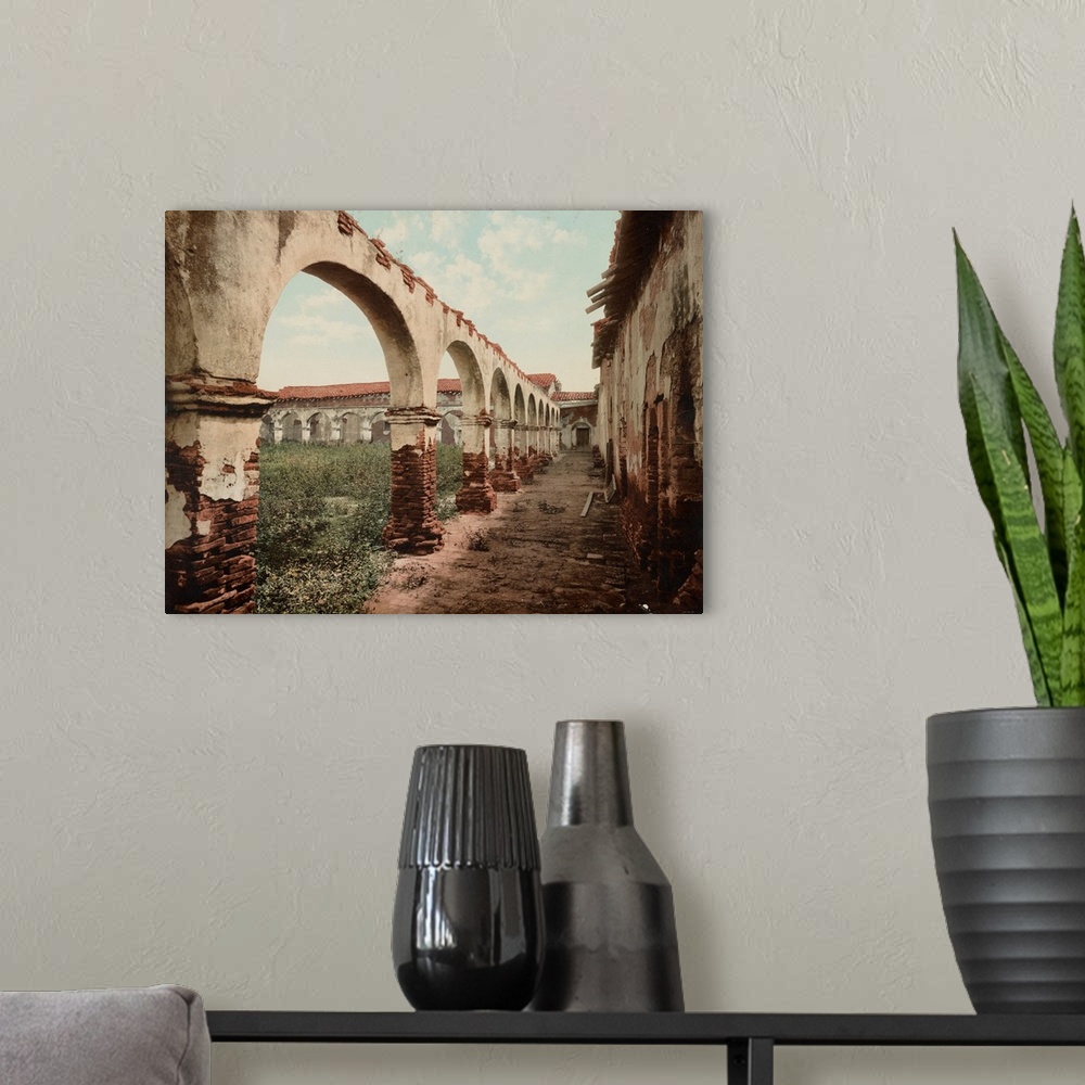 A modern room featuring Hand colored photograph of mission San Juan Capistrano, California.