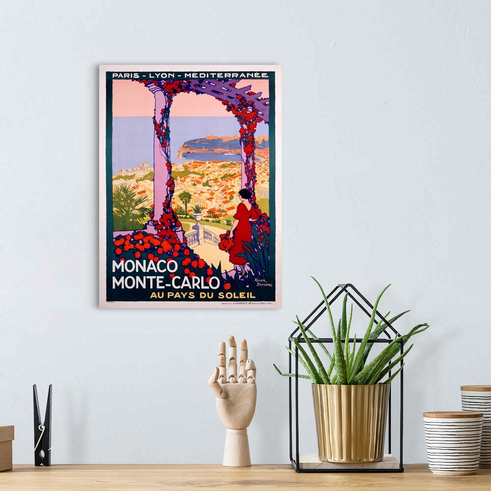 A bohemian room featuring Vintage Art Deco travel poster advertising travel and tourism to Monaco and Monte Carlo.