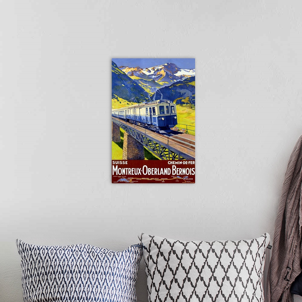 A bohemian room featuring Old advertising print for train.  There is an image of train crossing a  bridge with snow covered...
