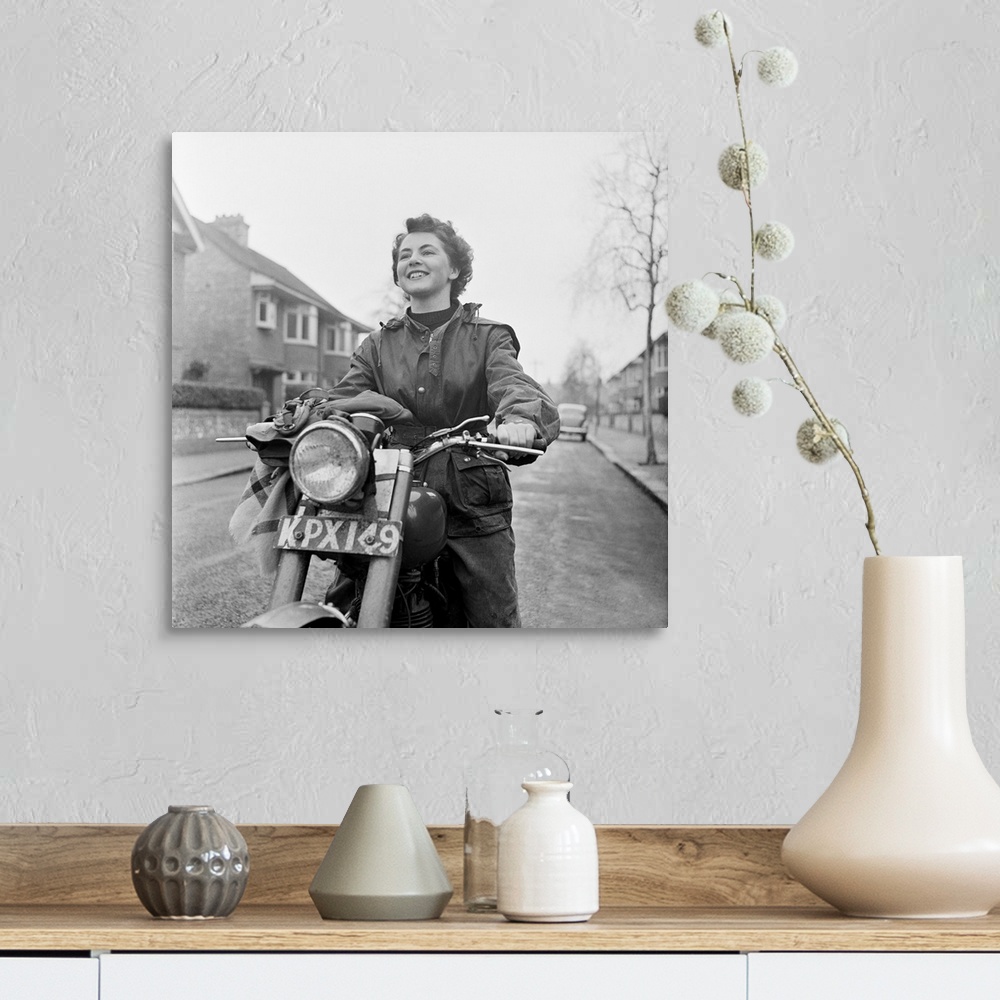 A farmhouse room featuring 3rd March 1951:  June Adams, aged 21, on her motorcycle, who competes in motorcycle trials at wee...