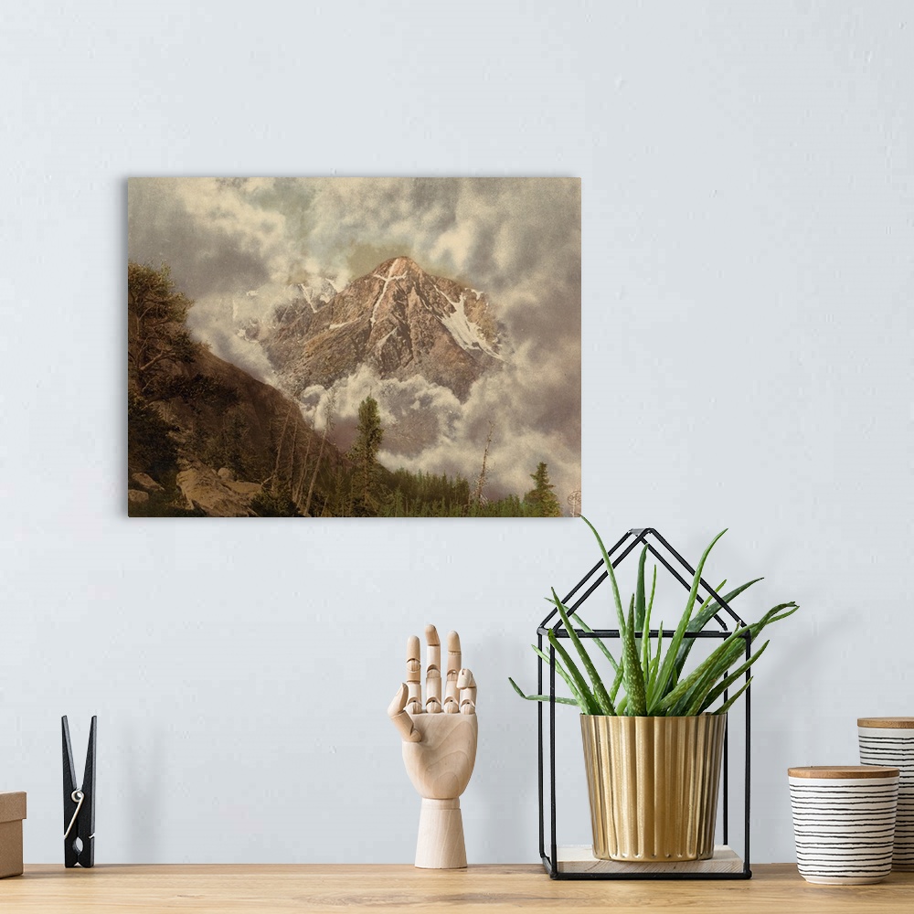 A bohemian room featuring Hand colored photograph of mount of the holy cross in the clouds.