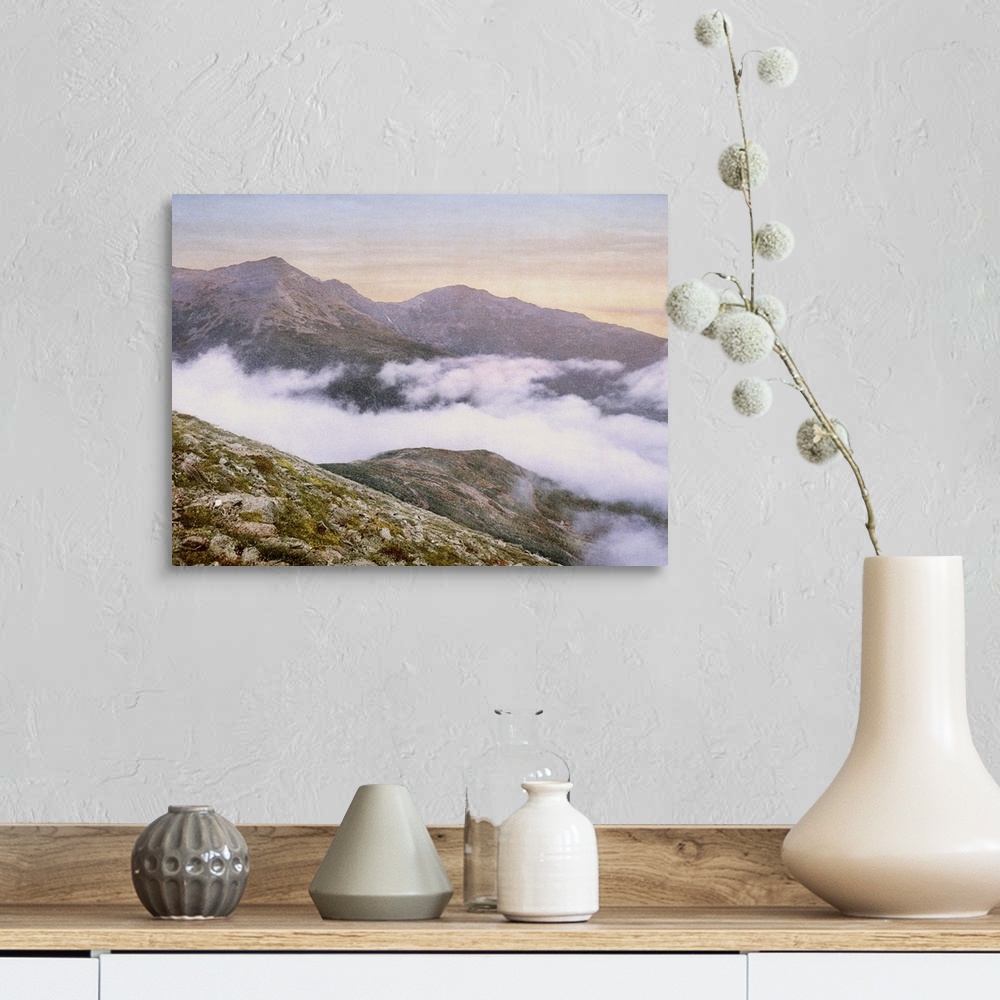 A farmhouse room featuring Photograph of mountains peeking through fog.