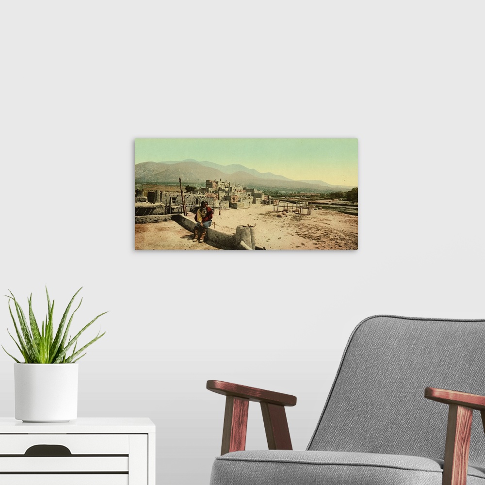 A modern room featuring Hand colored photograph of New Mexico. Pueblo de Taos.