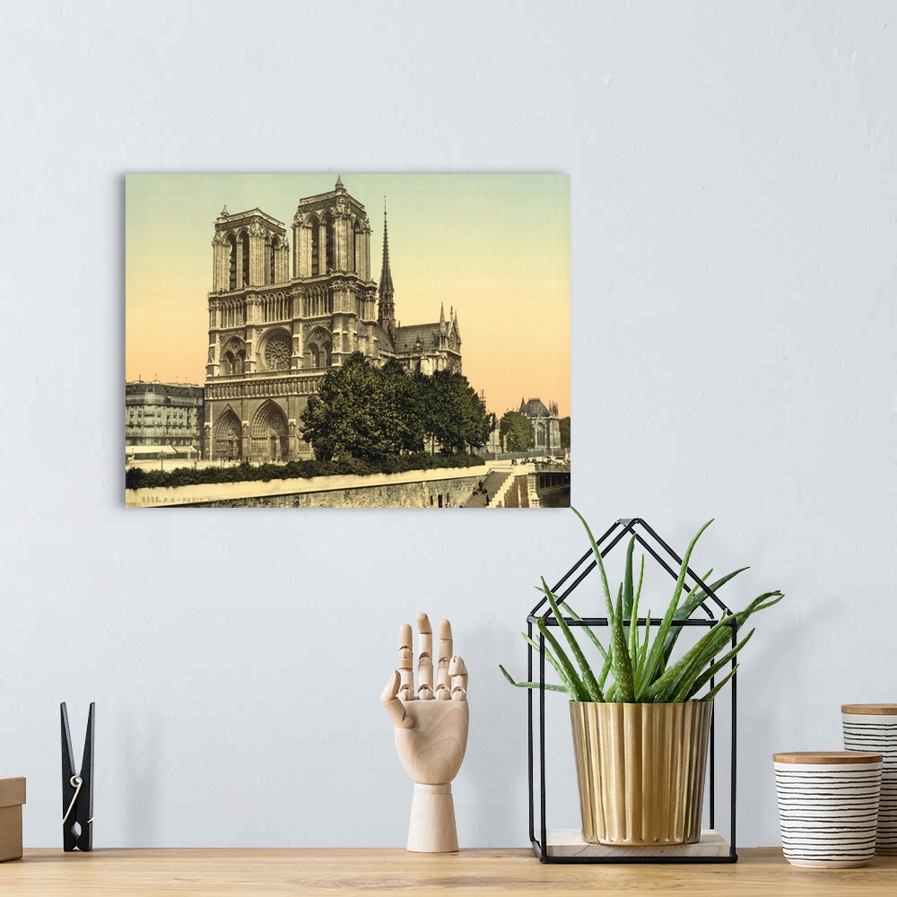A bohemian room featuring Hand colored photograph of Notre dame, Paris, France.