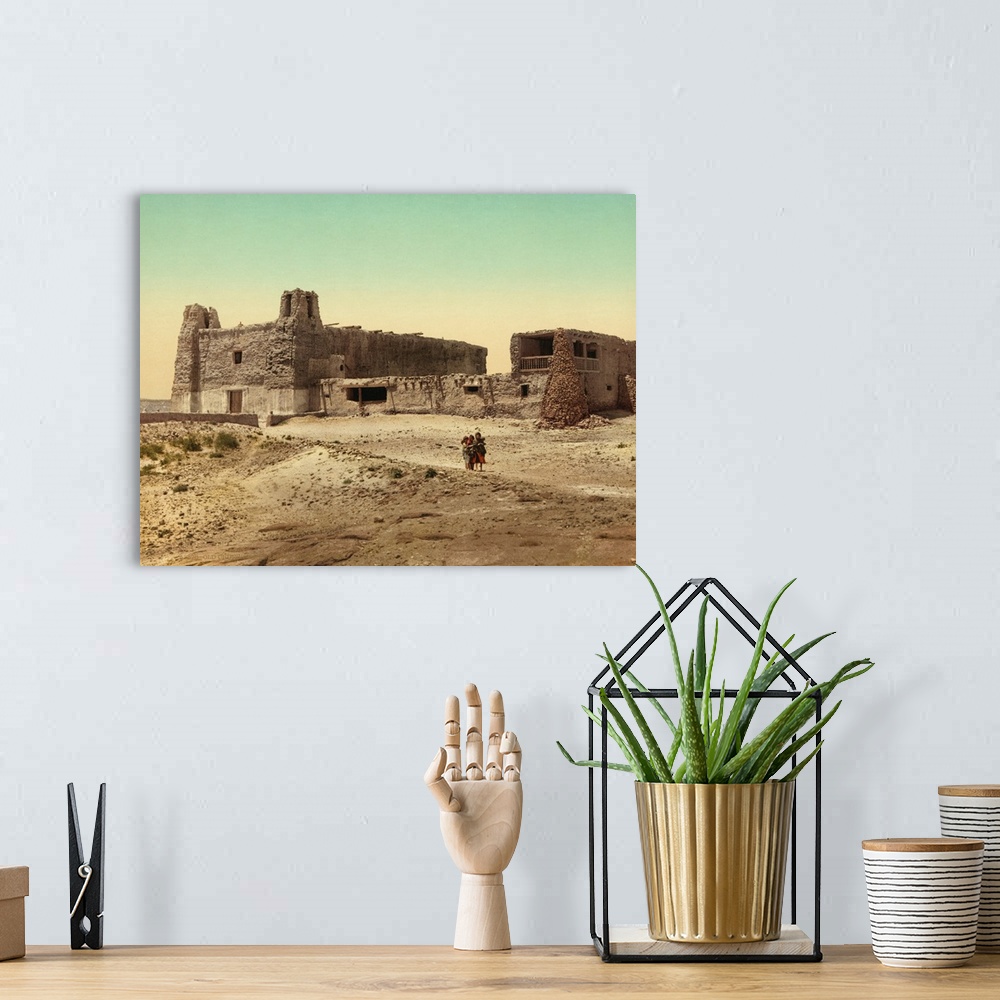 A bohemian room featuring Hand colored photograph of old church at pueblo of Acoma, New Mexico.