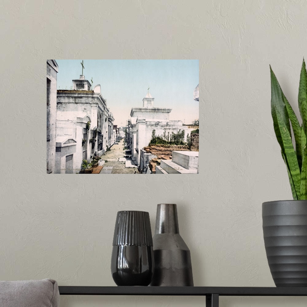 A modern room featuring Antiqued photo of a cemetery in New Orleans printed on to canvas.