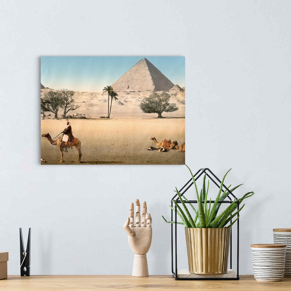 A bohemian room featuring Hand colored photograph of resting Bedouins and the grand pyramid, Cairo, Egypt.