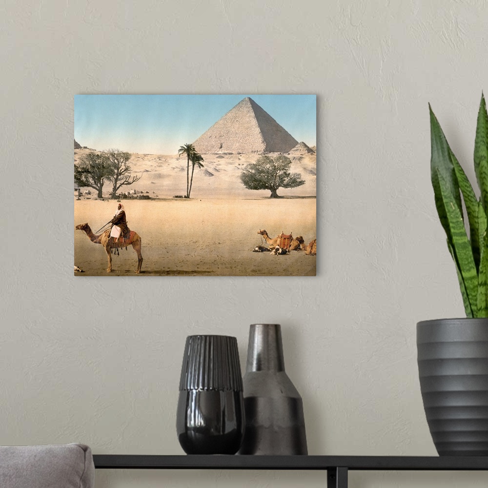A modern room featuring Hand colored photograph of resting Bedouins and the grand pyramid, Cairo, Egypt.