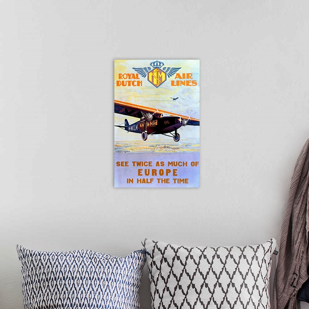 A bohemian room featuring Canvas wall art of an old advertisement for an airline company in Europe.