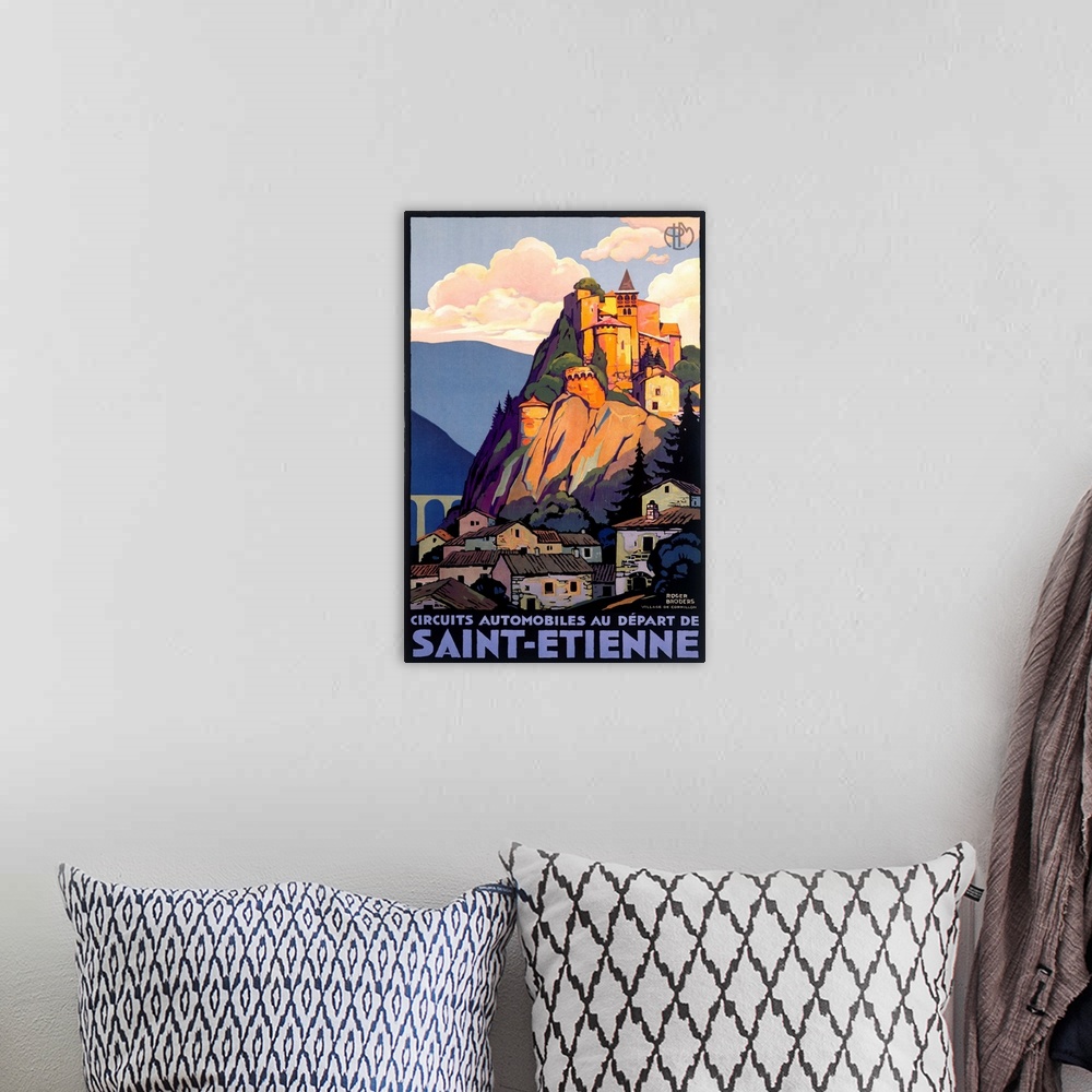 A bohemian room featuring Vintage travel poster depicting Saint Etienne and a castle high atop a mountain and cliff overloo...