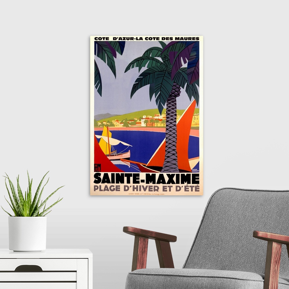 A modern room featuring Vertical, large vintage advertisement for Sainte-Maxime, France.  Palm trees over a body of water...