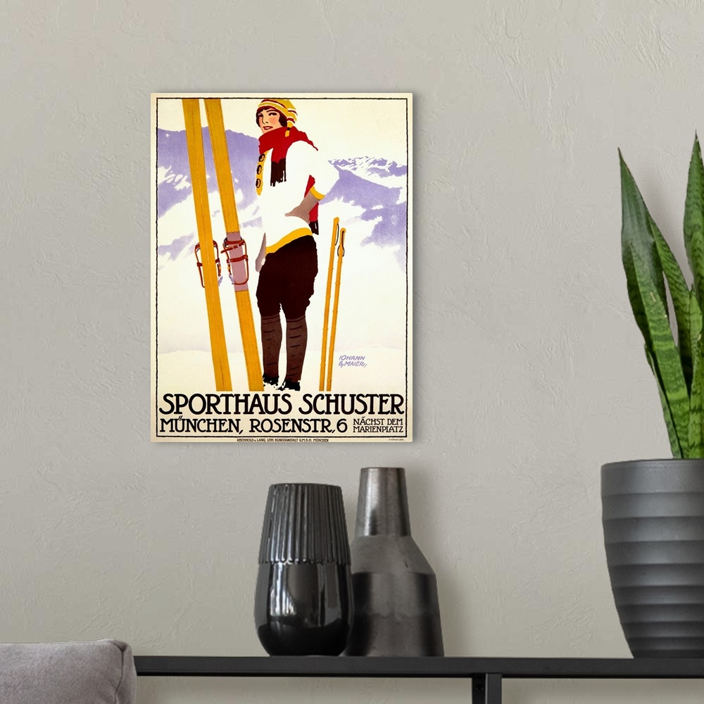 A modern room featuring Vintage artwork of a female skier standing in front of a mountain view with her skis and poles pl...