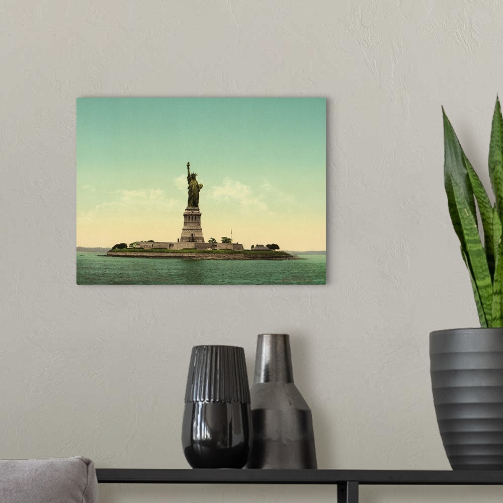A modern room featuring Hand colored photograph of statue of liberty, New York harbor.