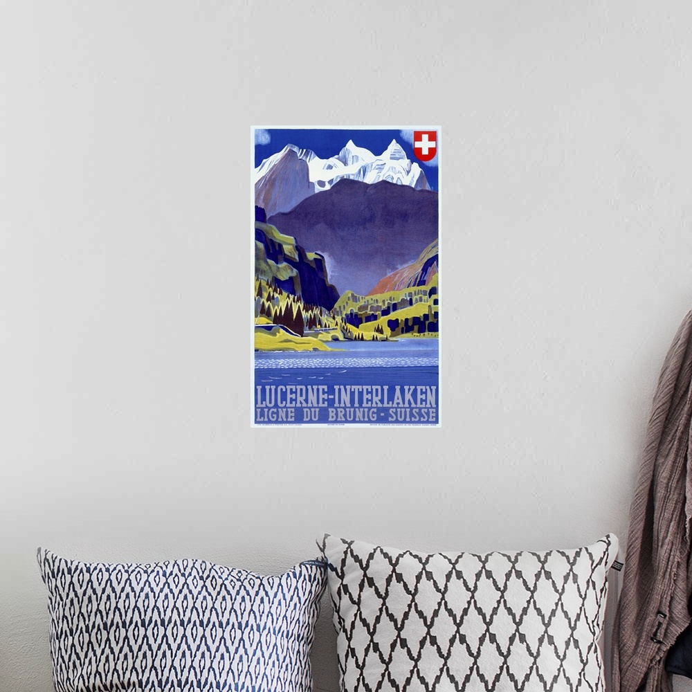 A bohemian room featuring Giant antique art displays a travel advertisement for a destination within the mountains of Switz...