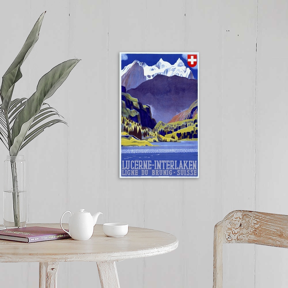 A farmhouse room featuring Giant antique art displays a travel advertisement for a destination within the mountains of Switz...