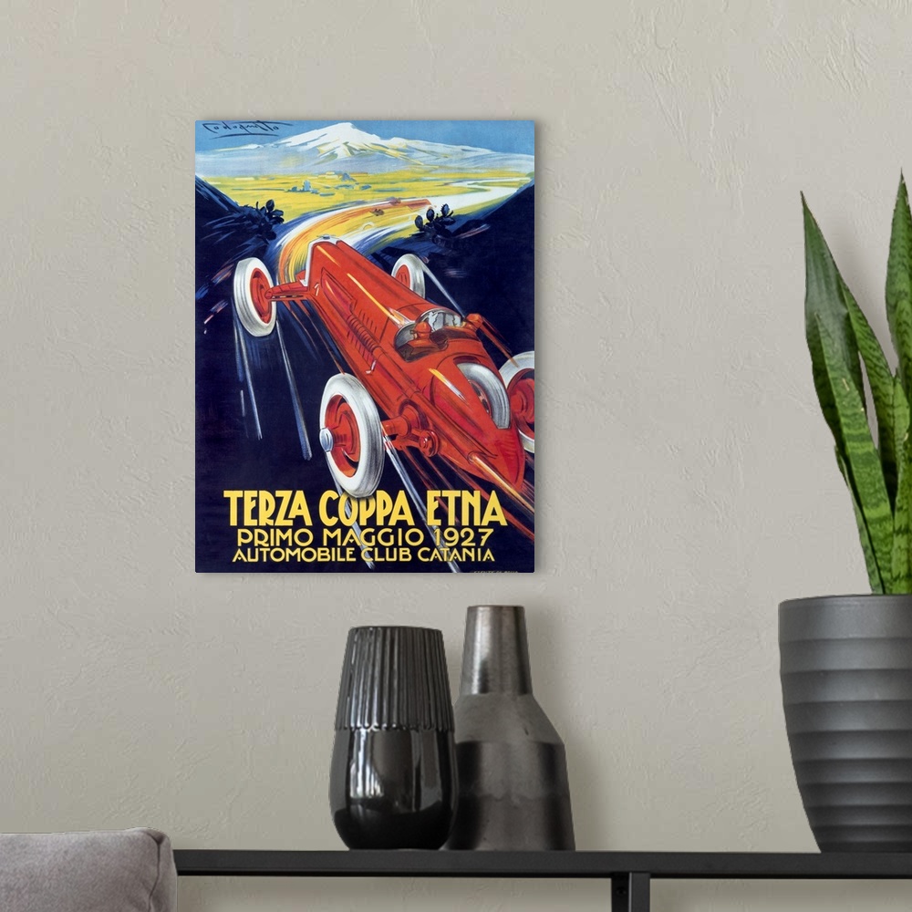 A modern room featuring Antique poster advertising a car club.  There is  a classic car racing through mountain roads on ...