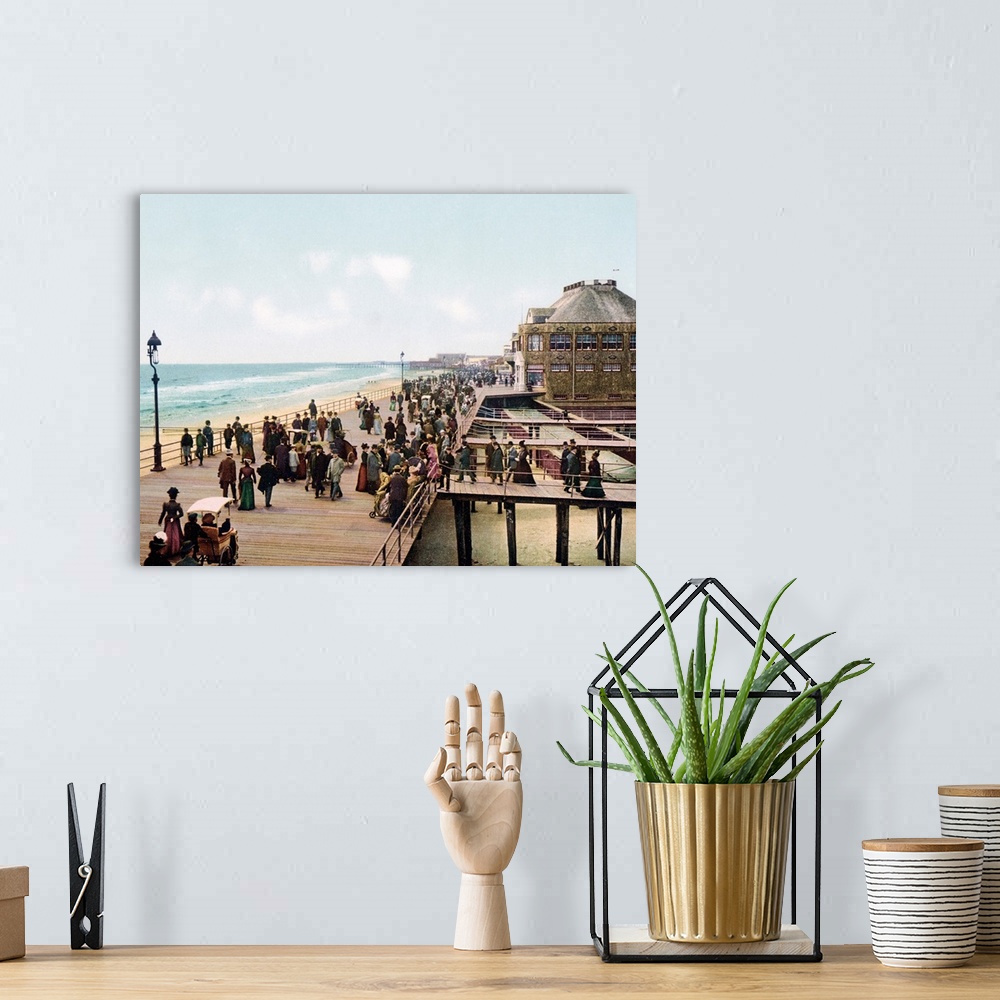 A bohemian room featuring Old photograph of well-dressed people walking along the Atlantic City Boardwalk in New Jersey. Se...