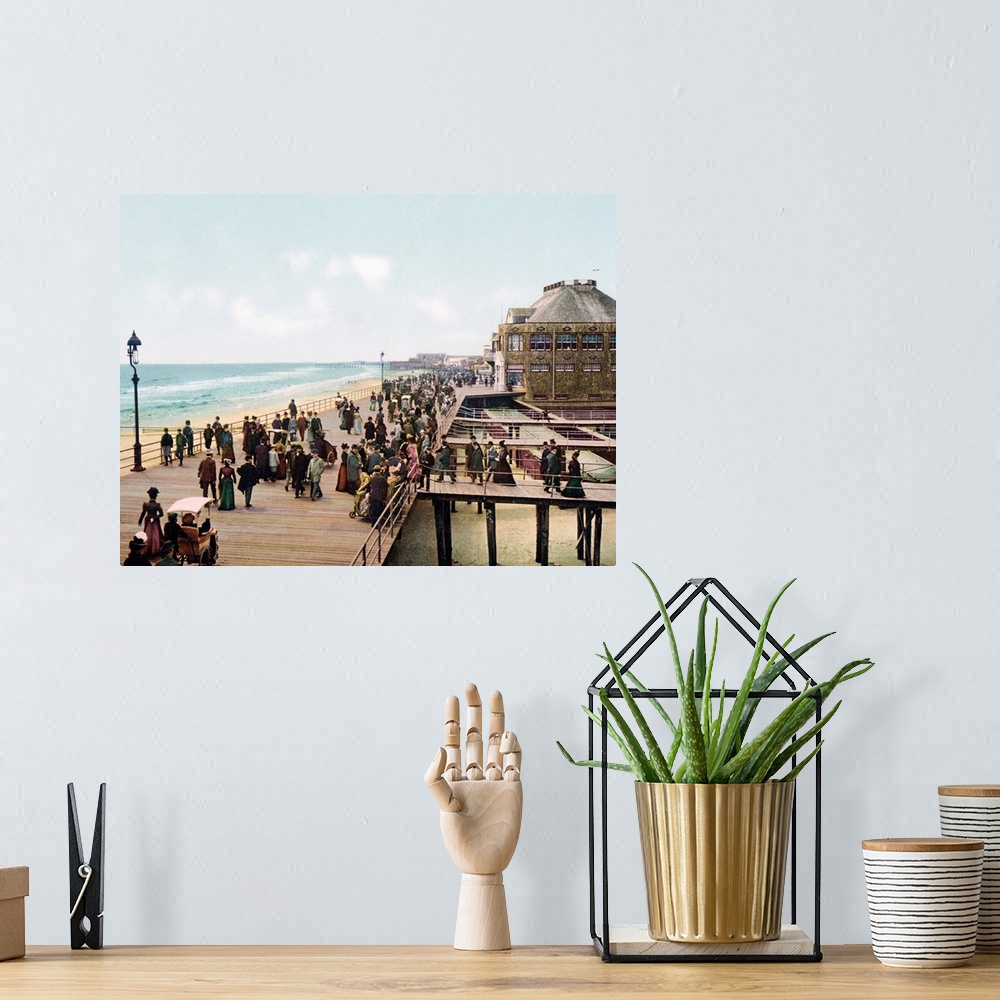 A bohemian room featuring Old photograph of well-dressed people walking along the Atlantic City Boardwalk in New Jersey. Se...