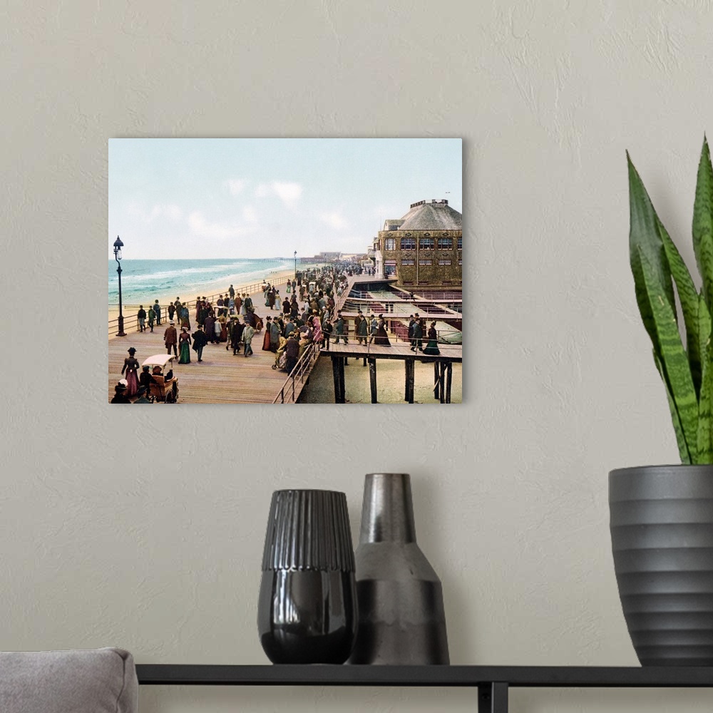 A modern room featuring Old photograph of well-dressed people walking along the Atlantic City Boardwalk in New Jersey. Se...