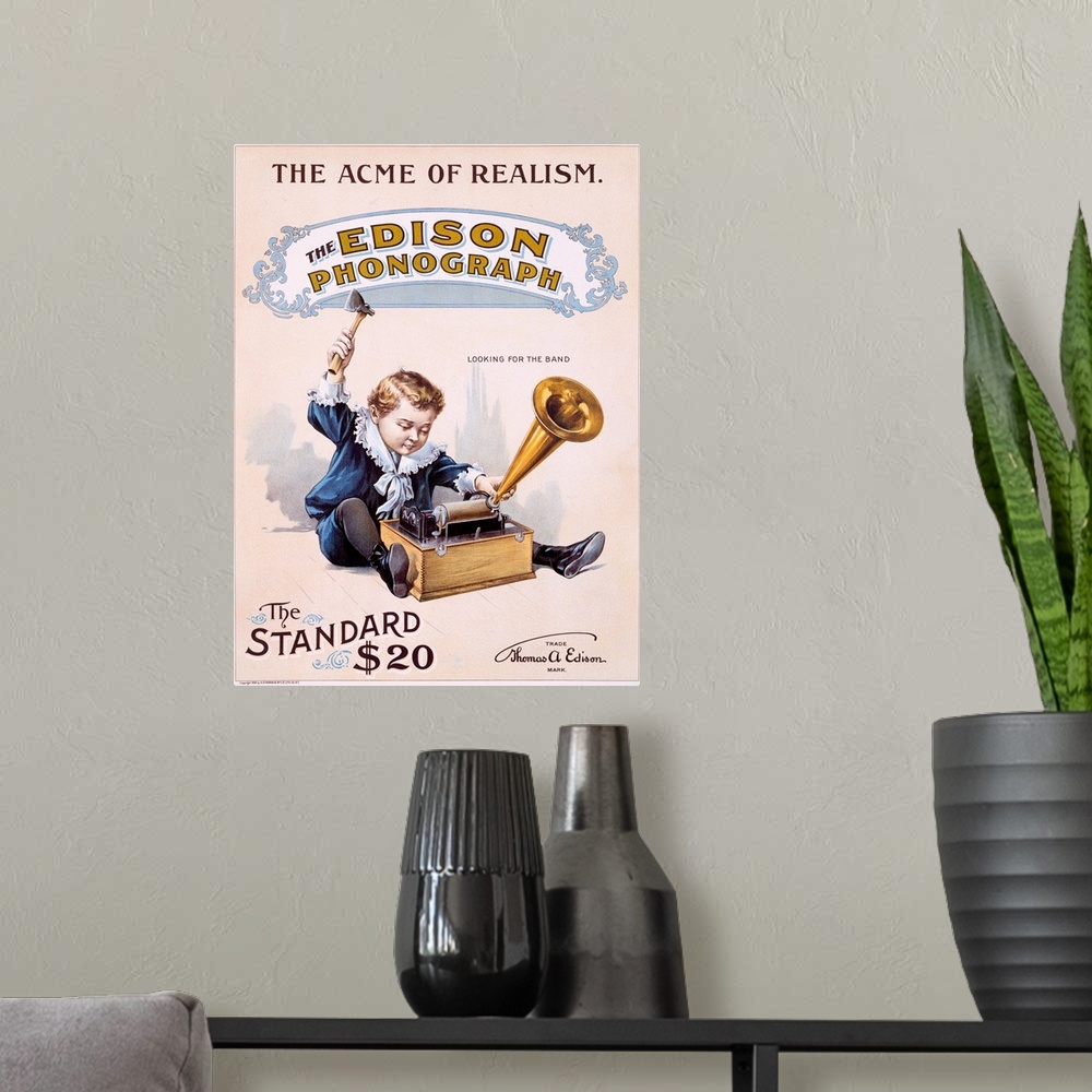 A modern room featuring Vintage poster showing a small boy playing with the Edison phonograph.