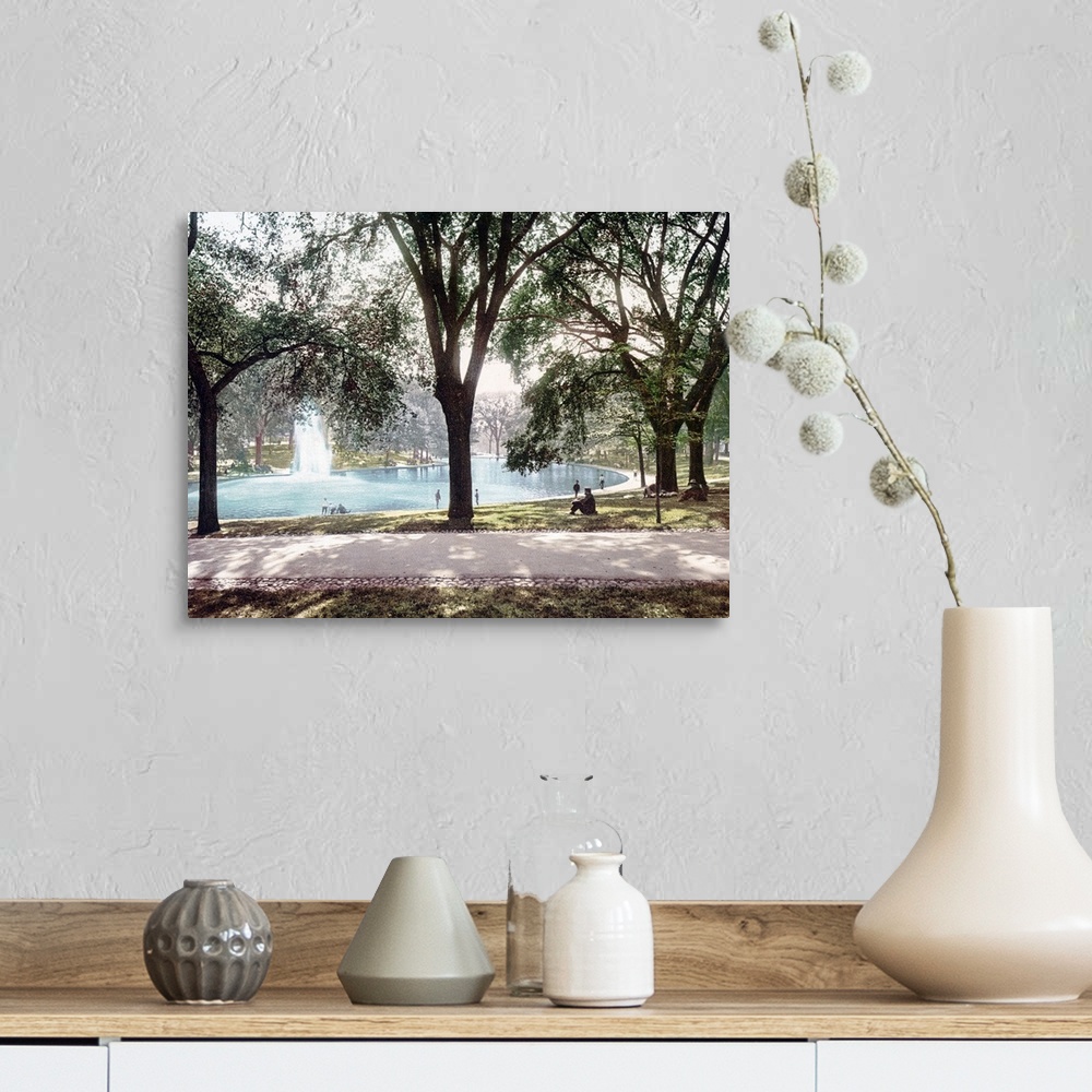 A farmhouse room featuring Vintage colored photograph of a pond in Boston Common Park with a spouting water feature in the m...