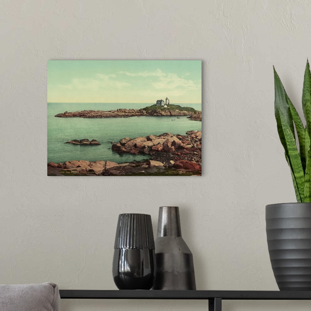 A modern room featuring Hand colored photograph of the nubble, York, Maine.