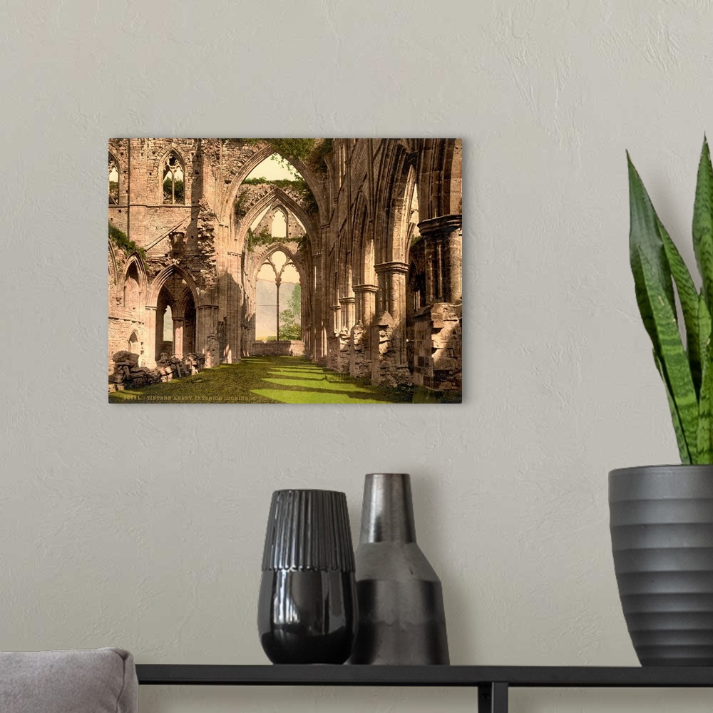 A modern room featuring Hand colored photograph of Tintern abbey, England.