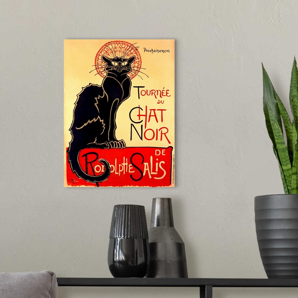 A modern room featuring Painting of a large black cat staring at the viewer with text.
