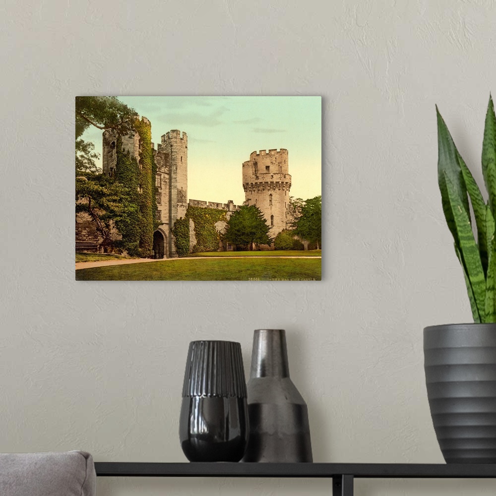 A modern room featuring Hand colored photograph of Warwick castle, England.