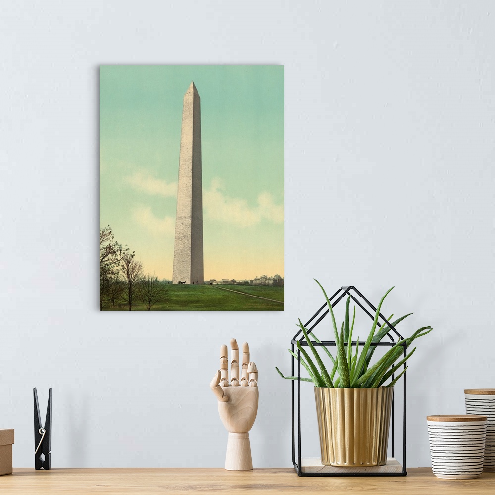 A bohemian room featuring Hand colored photograph of Washington monument.