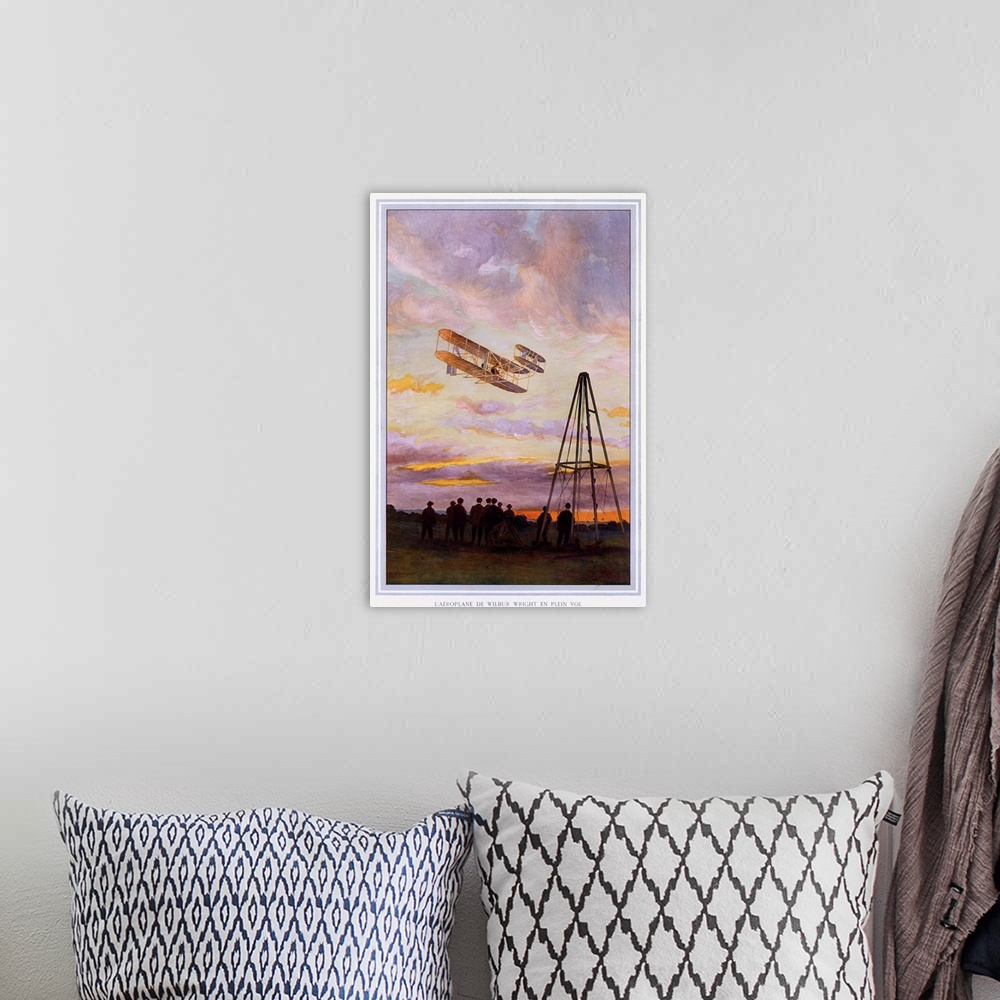A bohemian room featuring Big, vertical, vintage wall hanging of Wilbur Wright Aviation.  A group of people look upward at ...
