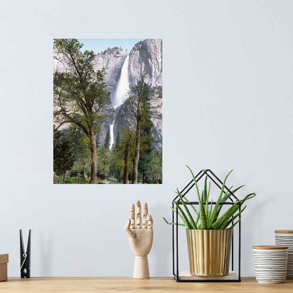 A bohemian room featuring Big, vertical photograph of Yosemite Falls seen through the trees in Yosemite Valley, California.