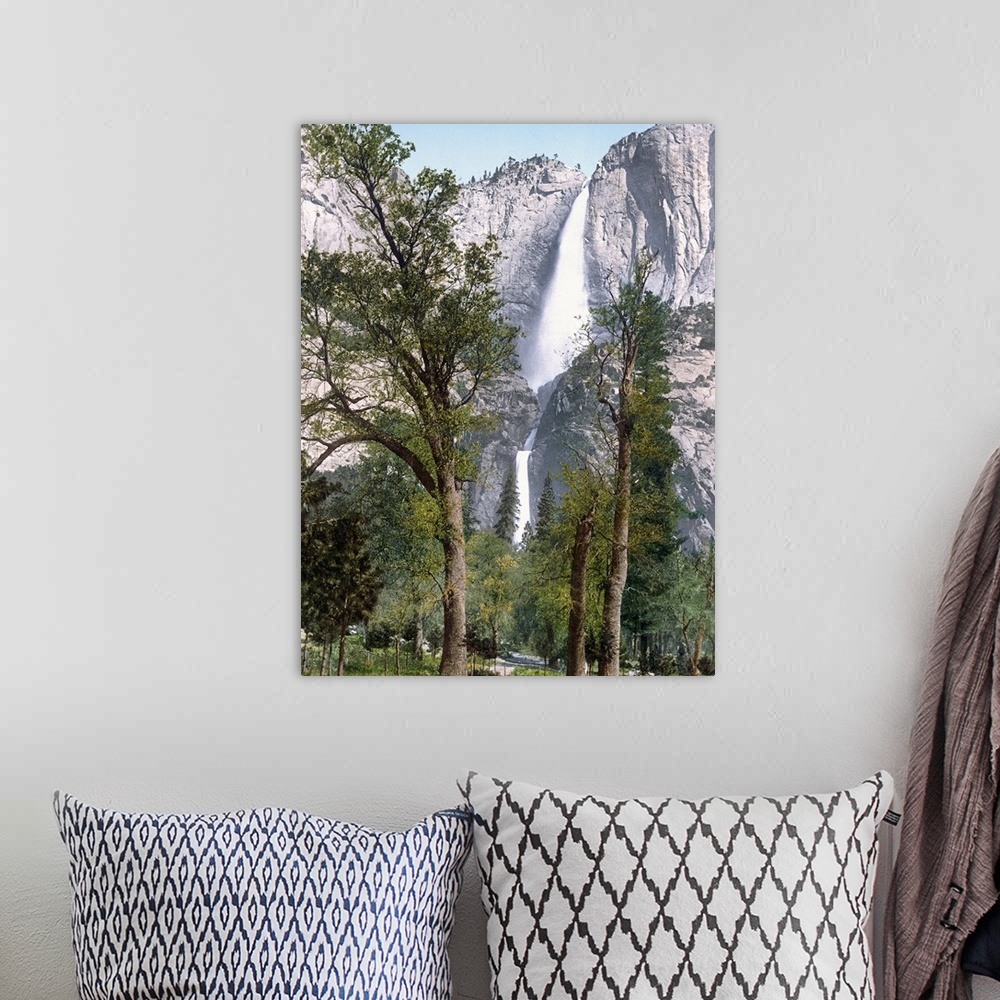 A bohemian room featuring Big, vertical photograph of Yosemite Falls seen through the trees in Yosemite Valley, California.