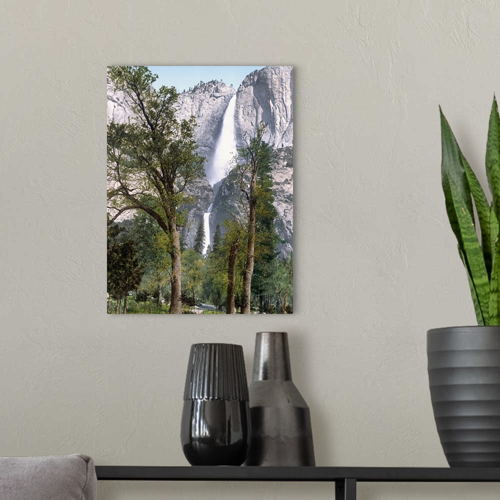A modern room featuring Big, vertical photograph of Yosemite Falls seen through the trees in Yosemite Valley, California.