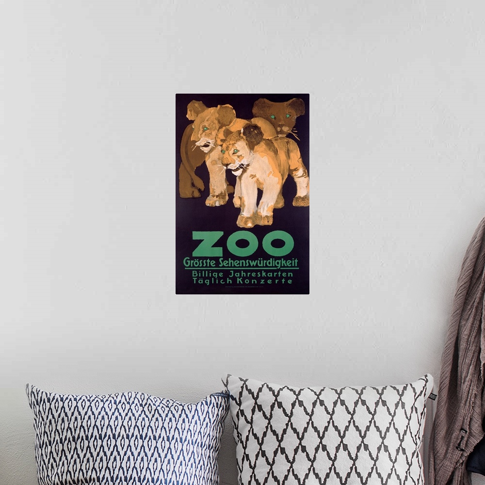 A bohemian room featuring A large vintage poster of three lion cubs with bold green eyes and bold green text below them.