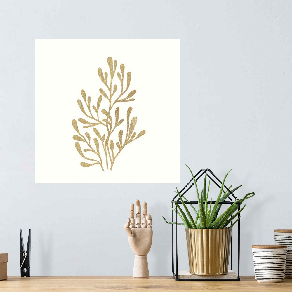 A bohemian room featuring Minimalist artwork of a golden seaweed outline on off-white.