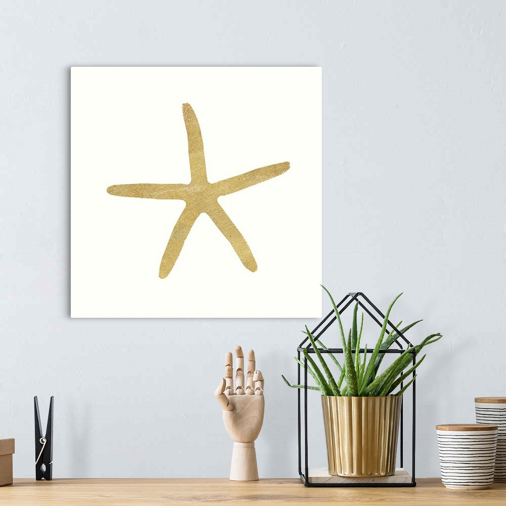 A bohemian room featuring Minimalist artwork of a golden starfish outline on off-white.