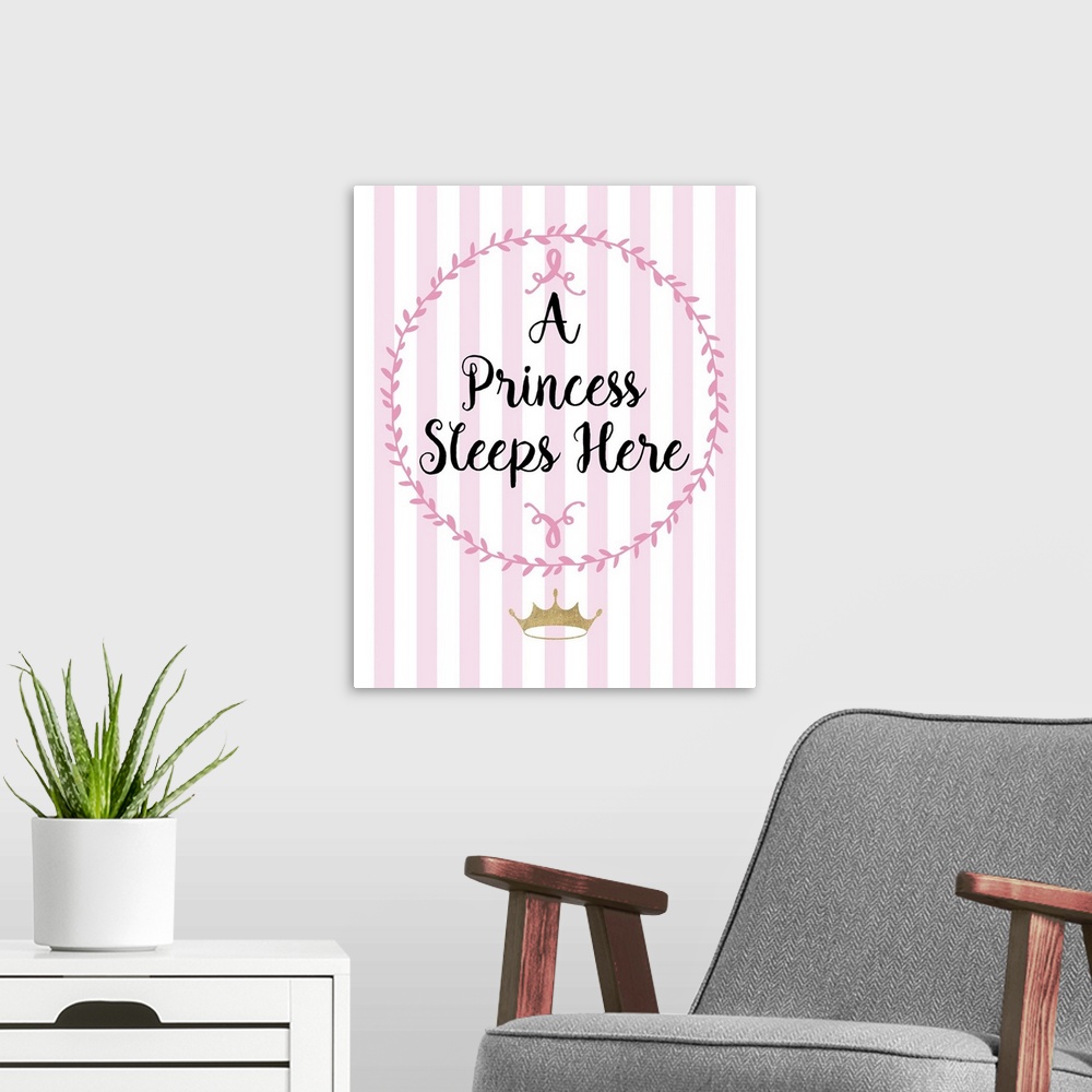 A modern room featuring Pink nursery art with black handlettered text and a gold crown.