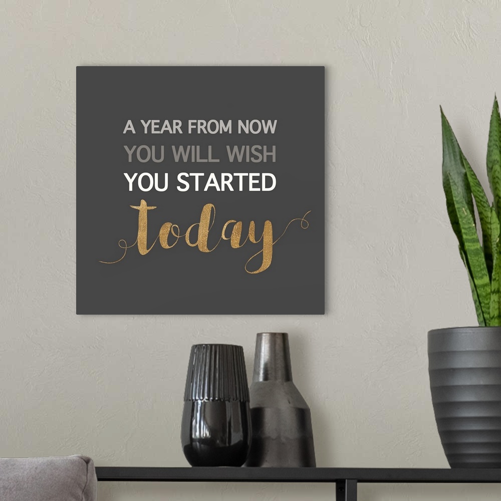 A modern room featuring Inspirational sentiment in gold and white text on dark grey.
