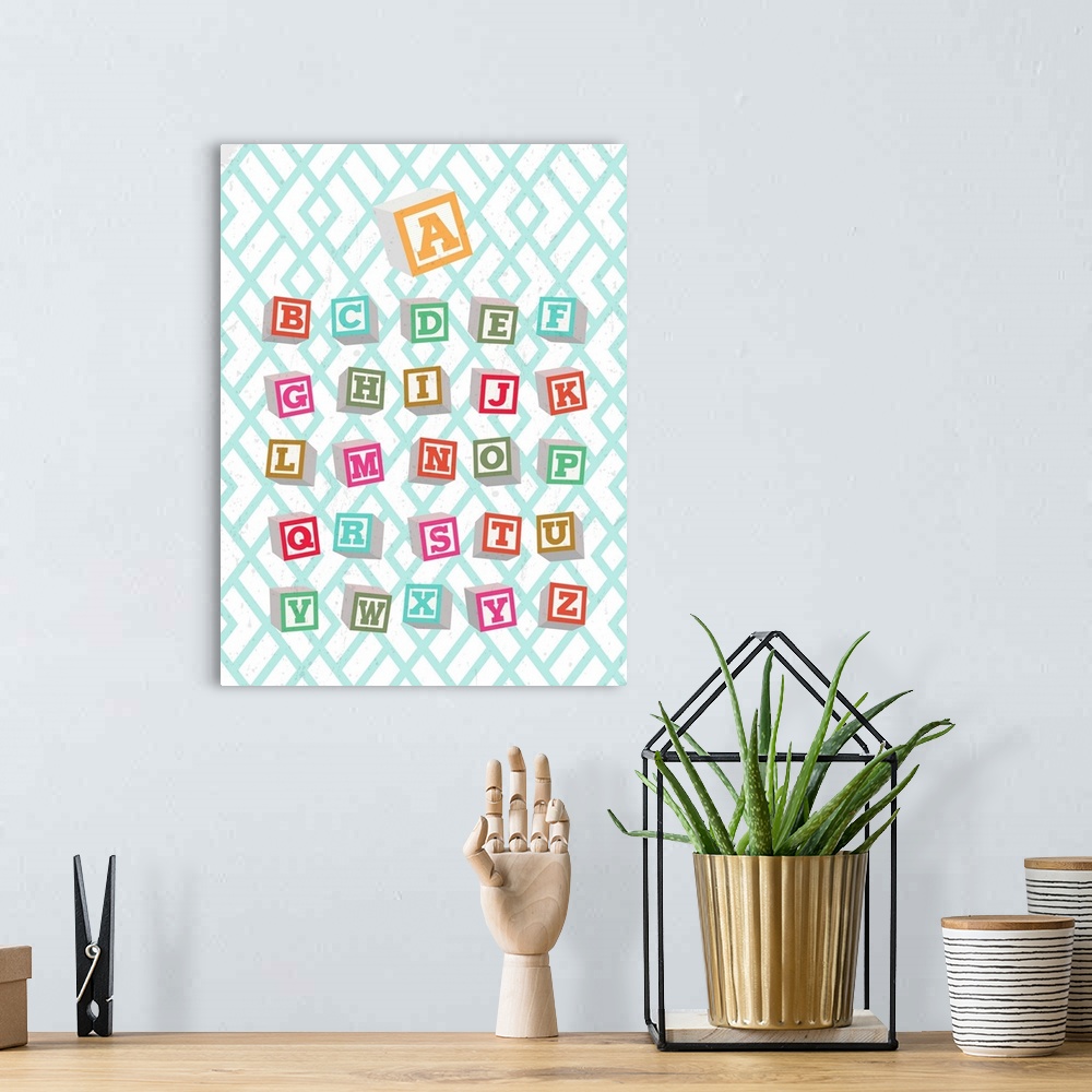 A bohemian room featuring Nursery room artwork of the alphabet written in toy blocks.