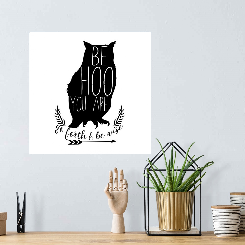 A bohemian room featuring Playful typography on a silhouette of an owl reading "Be Hoo You Are" and "Go Fourth and Be Wise"...